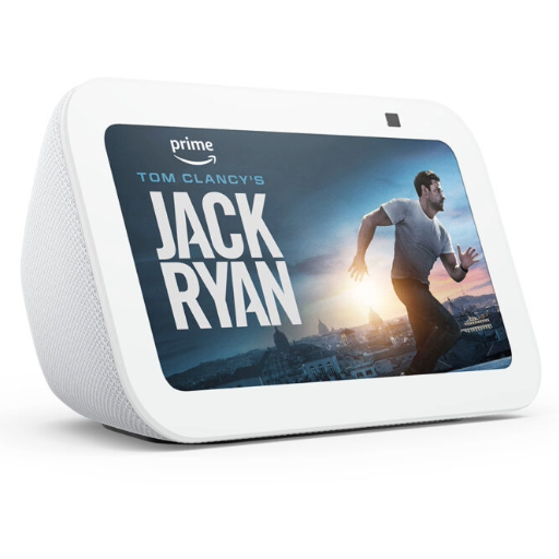 The Amazon Echo Show smart speaker. A white speaker with a rectangular screen at the front. The screen shows a promotional image for a Jack Ryan film.