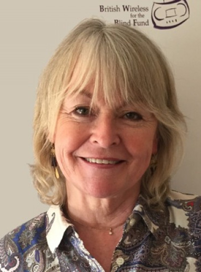 BWBF Patron Sue Cook is smiling to camera. She has blonde hair and is wearing a patterned shirt.