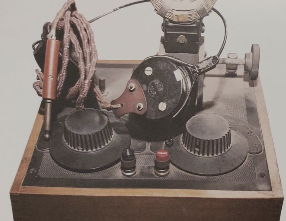 Photo of a Magnum Crystal Radio Receiver (c. 1929). A wooden box with braille dials on top.